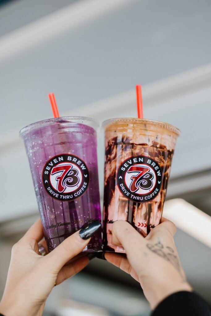  A customer at 7 Brew drive-thru speaker ordering sugar-free latte with barista taking order